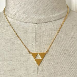 Trina Turk gold tone cut out triangle pendant necklace
